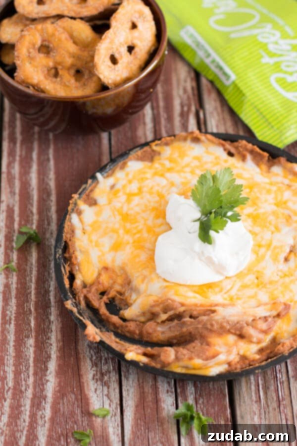Signature Chicken Tortilla Queso Dip 6 Creamy Refried Beans Dip, a classic Mexican-inspired appetizer.