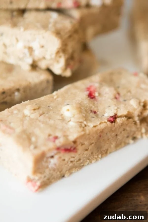 Delicious and healthy Dairy and Soy Free Strawberries and Cream Protein Bars for weight loss and energy. Homemade Dairy and Soy Free Strawberries and Cream Protein Bars offer a healthy and delicious snack option for weight management and energy. ohsweetbasil.com