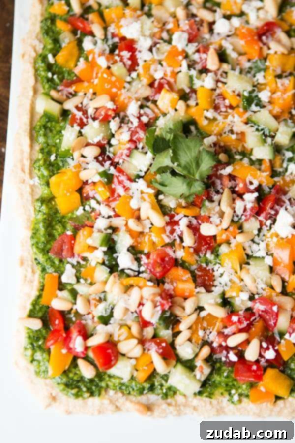8-Layer Hummus Dip with Pita Chips - Mediterranean Appetizer Delicious 8-Layer Hummus Dip with Fresh Toppings and Pita Chips