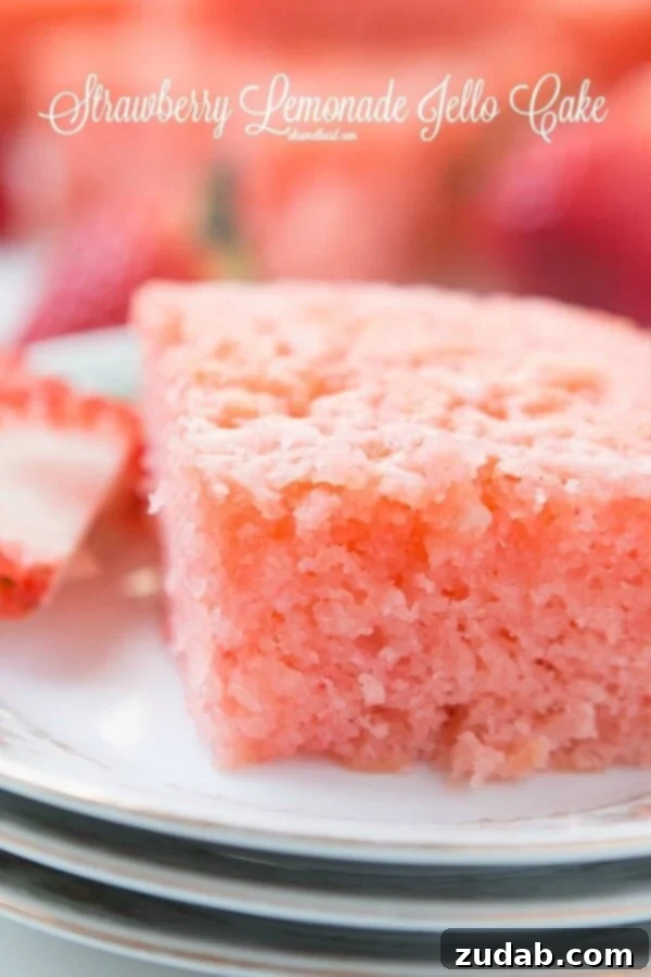 Moist Strawberry Lemonade Jello Cake Close-up of a moist Strawberry Lemonade Jello Cake with lemon glaze, perfect for dessert.