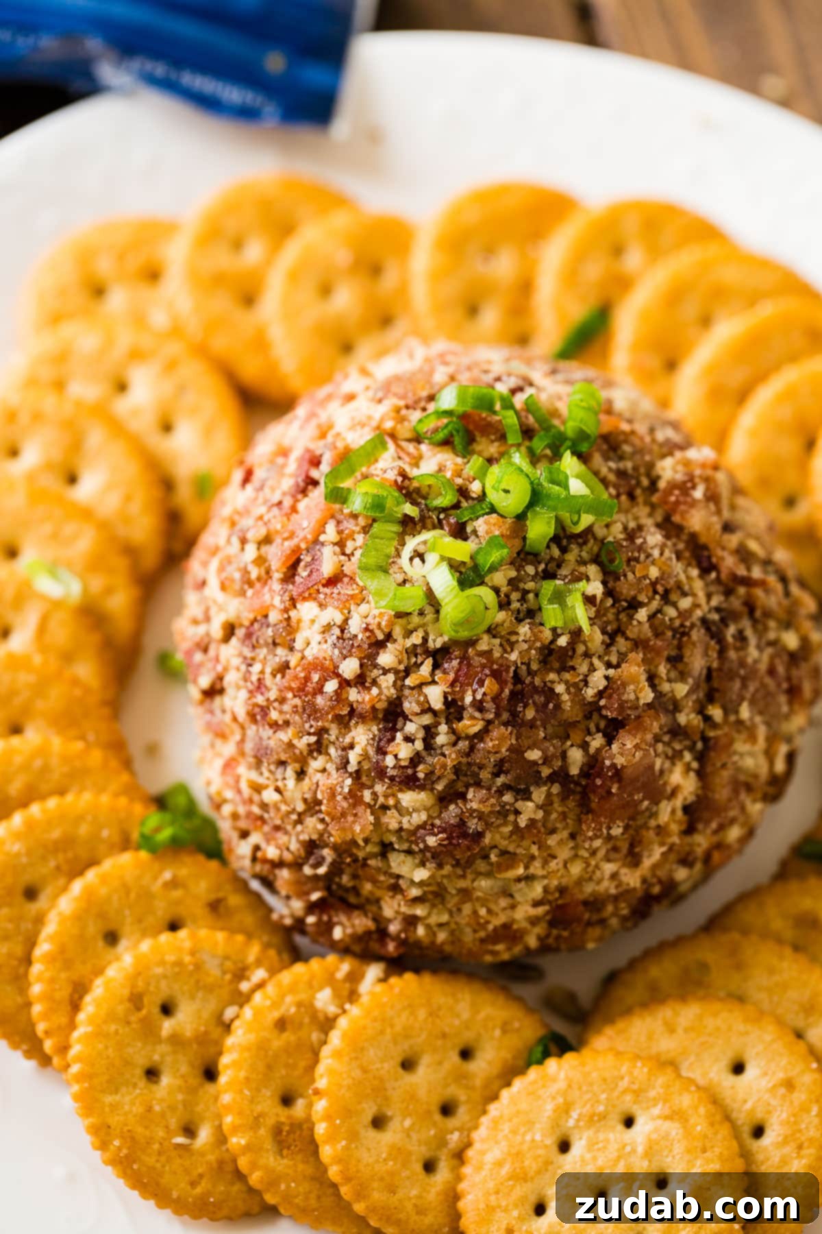 Ultimate BBQ Bacon Cheese Ball 2 A delicious BBQ Bacon Cheese Ball, perfect for parties and gatherings. It's easy to make and features popular flavors like bacon, cheese, and BBQ sauce.