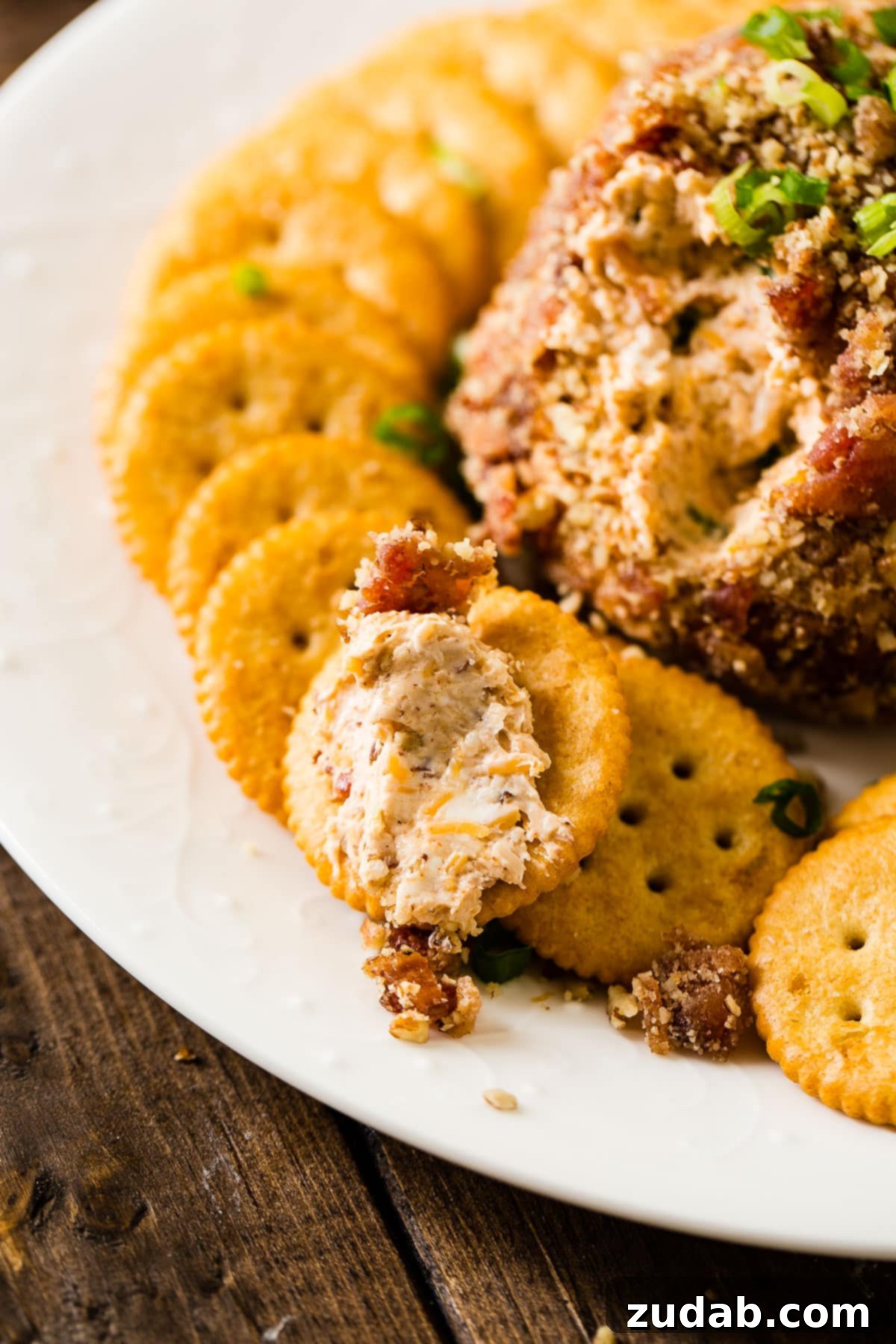 Ultimate BBQ Bacon Cheese Ball 6 The ultimate party appetizer, this BBQ Bacon Cheese Ball is loaded with creamy cheese, smoky BBQ sauce, savory bacon, and coated in crunchy pecans. Get the recipe at ohsweetbasil.com.