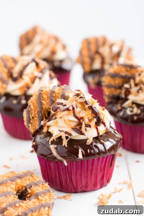 Island Caramel Coconut Cupcakes 2 Girl scout cookie meets cupcake in these rich chocolaty, caramel, and toasted coconut Samoa Cupcakes!