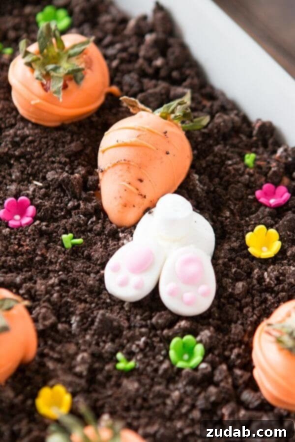Easy Chocolate Oreo No-Bake Dessert for Easter Close-up of the adorable marshmallow bunnies and candy melt carrots in the chocolate Oreo dessert