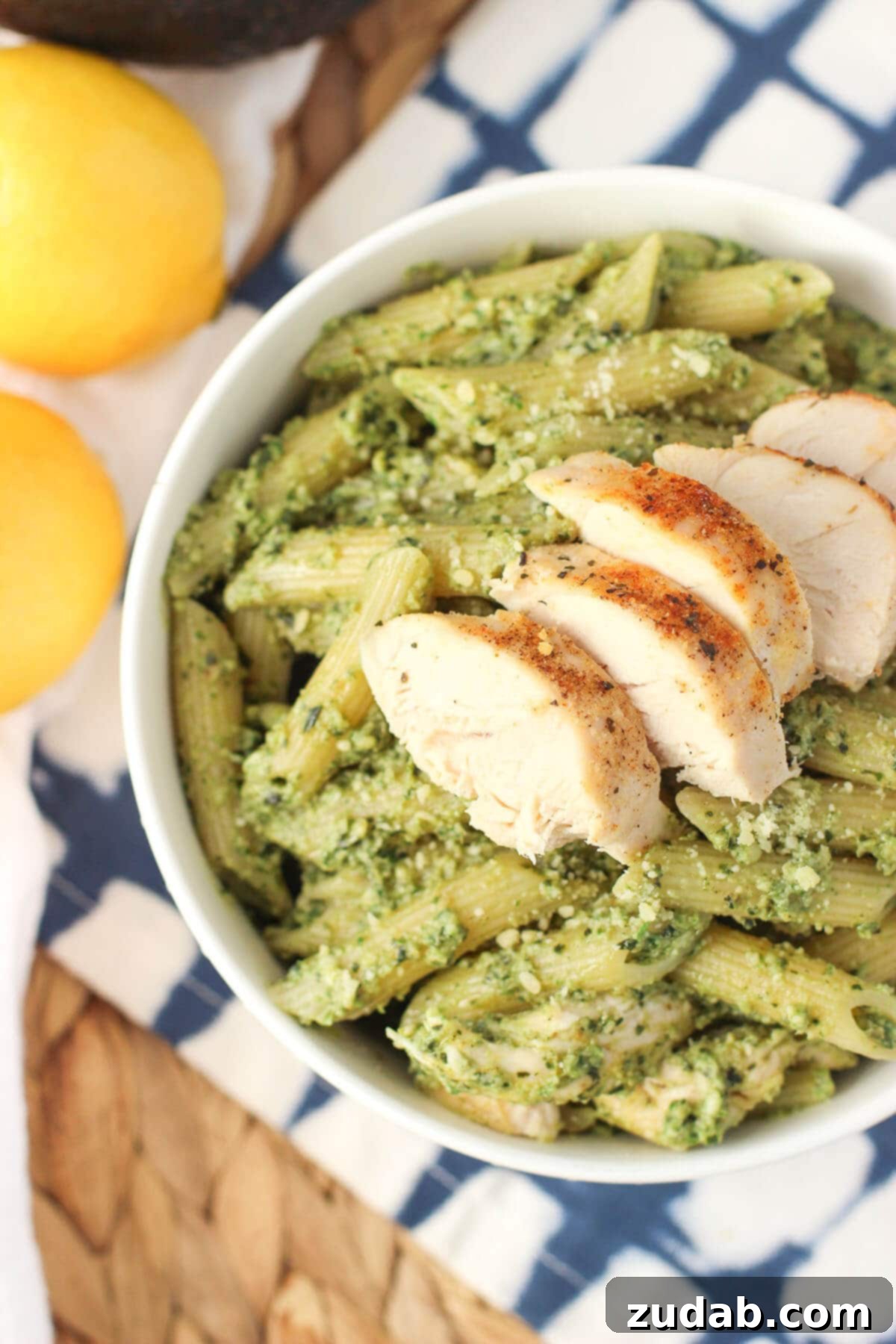 Creamy Avocado Pesto Chicken Pasta - A quick weeknight meal with a lighter, creamy sauce, perfect for using leftover chicken! This avocado pesto chicken pasta is a quick weeknight meal with a lighter and creamy sauce. A great way to use leftover chicken!