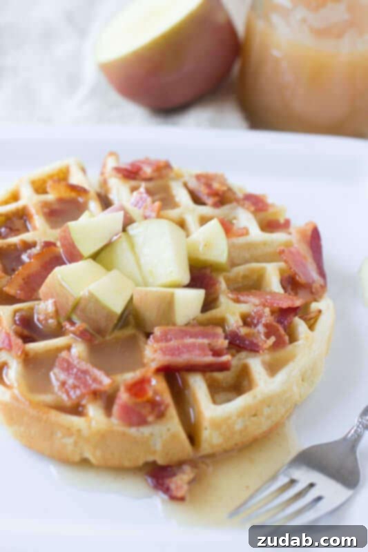 The Only Waffle Recipe You'll Ever Need 5 Fluffy waffles with sweet apples and crisp bacon, drizzled with the best apple cider syrup. A delightful breakfast from ohsweetbasil.com.