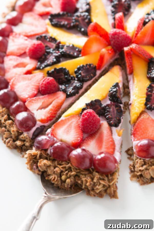 Homemade Granola Crust for Breakfast Fruit Pizza Preparing the hearty granola crust for our Breakfast Fruit and Yogurt Pizza. This thick, flavorful base bakes to a perfect crunch, providing an excellent foundation for sweet toppings.