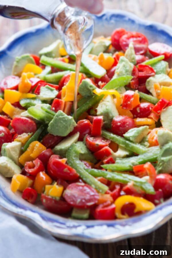 A fresh twist on a classic tomato salad, add avocado and a balsamic vinaigrette for a lovely garden balsamic avocado salad! ohsweetbasil.com Whole 30, paleo, gluten-free, dairy-free, vegetarian A fresh twist on a classic tomato salad, add avocado and a balsamic vinaigrette for a lovely garden balsamic avocado salad! ohsweetbasil.com Whole 30, paleo, gluten-free, dairy-free, vegetarian