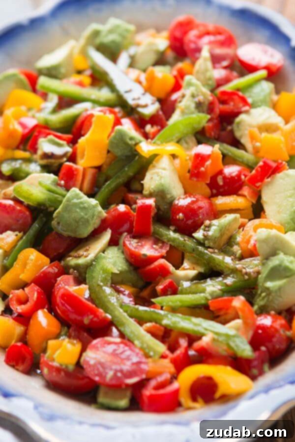 A fresh twist on a classic tomato salad, add avocado and a balsamic vinaigrette for a lovely garden balsamic avocado salad! ohsweetbasil.com Whole 30, paleo, gluten-free, dairy-free, vegetarian A fresh twist on a classic tomato salad, add avocado and a balsamic vinaigrette for a lovely garden balsamic avocado salad! ohsweetbasil.com Whole 30, paleo, gluten-free, dairy-free, vegetarian