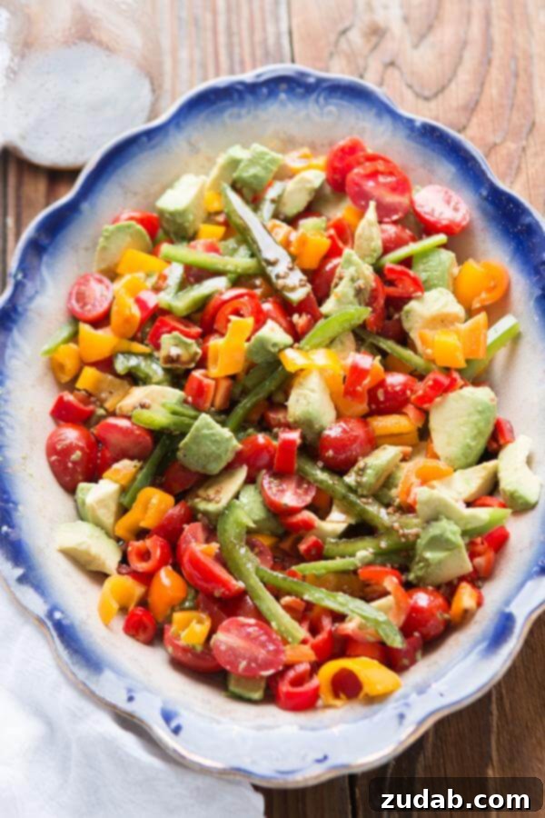 A fresh twist on a classic tomato salad, add avocado and a balsamic vinaigrette for a lovely garden balsamic avocado salad! ohsweetbasil.com Whole 30, paleo, gluten-free, dairy-free, vegetarian A fresh twist on a classic tomato salad, add avocado and a balsamic vinaigrette for a lovely garden balsamic avocado salad! ohsweetbasil.com Whole 30, paleo, gluten-free, dairy-free, vegetarian