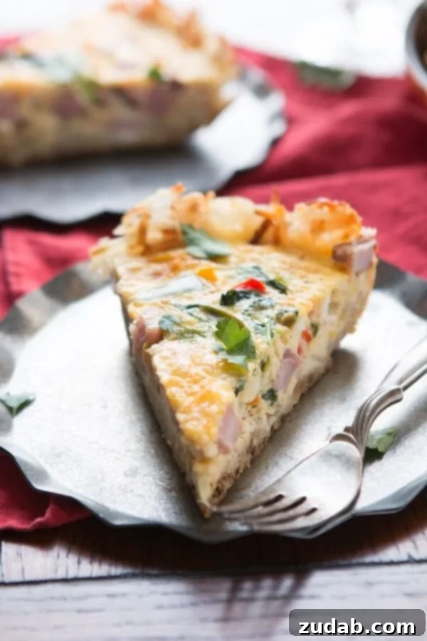 Golden hash browns make a great crust for this hash browns ham frittata! Serve as is or with hot sauce for a spicy little pop! low-carb Crispy hash brown crust being pressed into an oven-safe skillet, ready for the frittata filling.