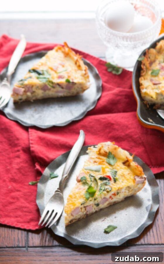 Golden hash browns make a great crust for this hash browns ham frittata! Serve as is or with hot sauce for a spicy little pop! low-carb Egg and ham filling poured into the hash brown crust in a cast iron skillet, ready for baking.
