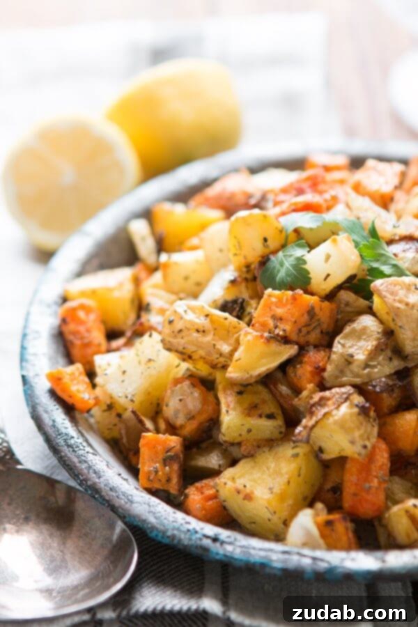 Perfectly Roasted Root Vegetables: A Delicious and Healthy Side or Main Dish Close-up of golden roasted root vegetables in a rustic serving bowl, with a serving spoon beside it, ready to be enjoyed.