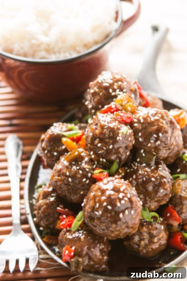 Sweet and Sour Meatballs for Oven or Slow Cooker Delicious sweet and sour meatballs, perfect for dinner or an appetizer for football parties, baked in the oven or slow cooker.