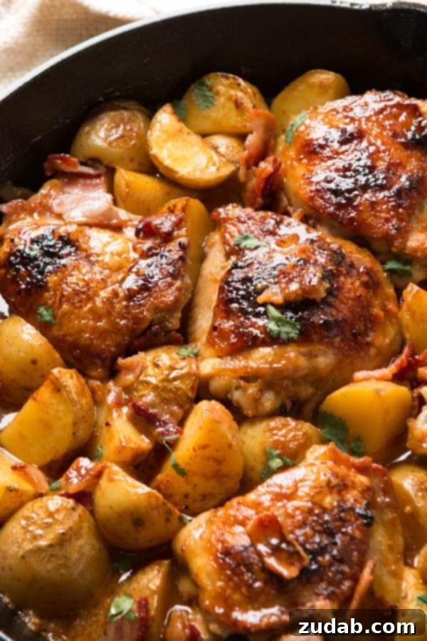 Hands down, our absolute most favorite recipe ever is this juicy, saucy braised dijon chicken and potatoes that's a one skillet wonder! paleo, whole 30 Dijon braised chicken thighs and potatoes simmering in a cast iron skillet, covered in a rich, tangy sauce.