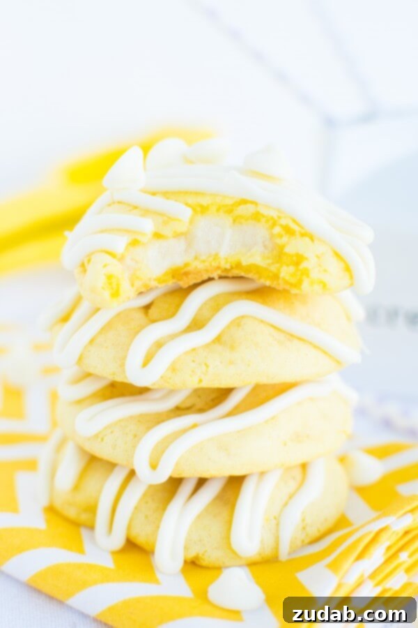 Soft and Chewy Lemon Cremesicle Cookies with Cream Cheese Filling and White Chocolate Drizzle Soft and chewy lemon cremesicle cookies stuffed with a sweet, tangy cream cheese filling and drizzled in white chocolate!
