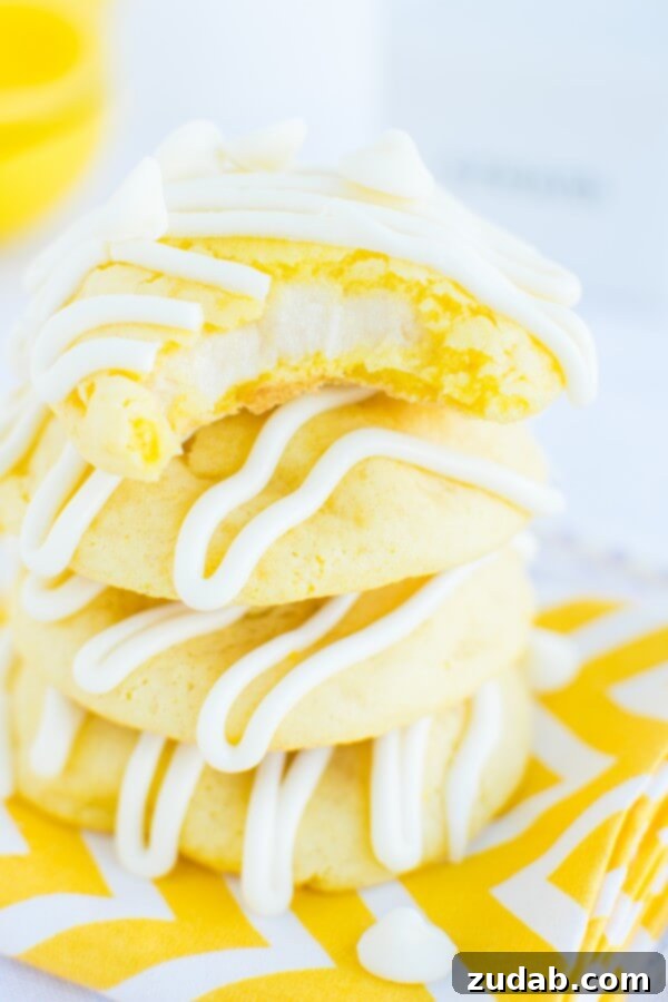 Perfectly Baked Lemon Cremesicle Cookies Soft and chewy lemon cremesicle cookies stuffed with a sweet, tangy cream cheese filling and drizzled in white chocolate!