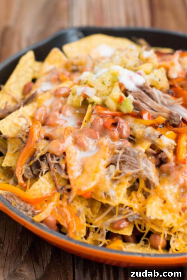 Hawaii's BEST pork nachos with rich pina colada sauce, a savory and sweet combination.