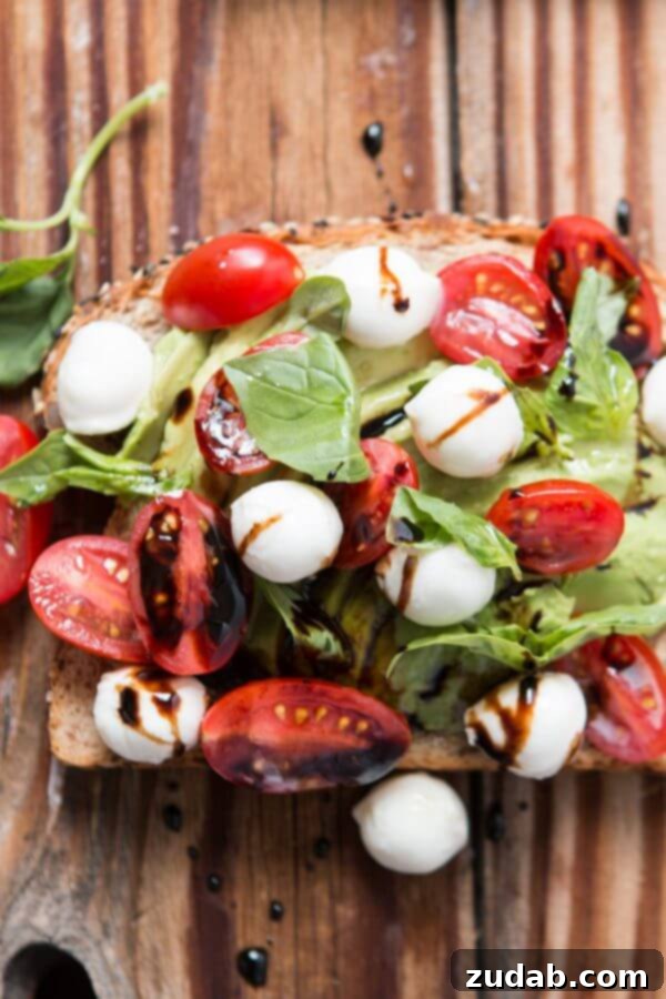 Beyond Basic: 6 Epic Avocado Toast Ideas 9 Caprese Avocado Toast with mozzarella, tomatoes, basil, and balsamic glaze.