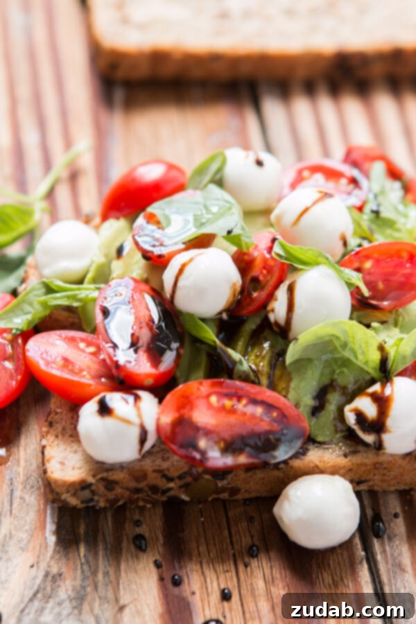 Beyond Basic: 6 Epic Avocado Toast Ideas 10 Close-up of delicious Caprese Avocado Toast.