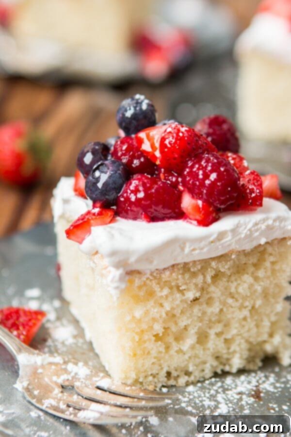 Moist Berry White Yogurt Cake for Summer Dessert Moist Berry White Yogurt Cake topped with fresh berries, perfect for a summer snack cake