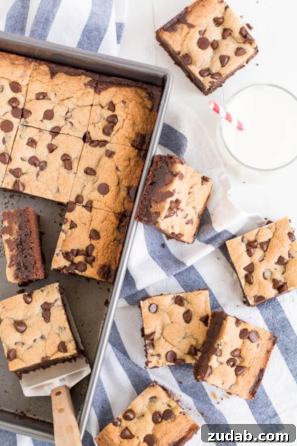 A baking pan filled with freshly baked Brookie bars, accompanied by a refreshing glass of milk.