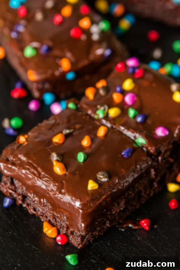 Perfectly Fudgy Homemade Cosmic Brownies with Rainbow Candies A second image of the Cosmic Brownies Copycat Recipe, showcasing their irresistible fudgey texture and rainbow chip topping.