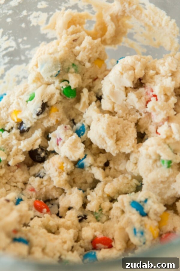 Buttery Shortbread M&M Cookies: A delightful treat for school lunches, picnics, or relaxing Sundays. Perfectly round Shortbread M&M Cookies cooling on a wire rack after baking.