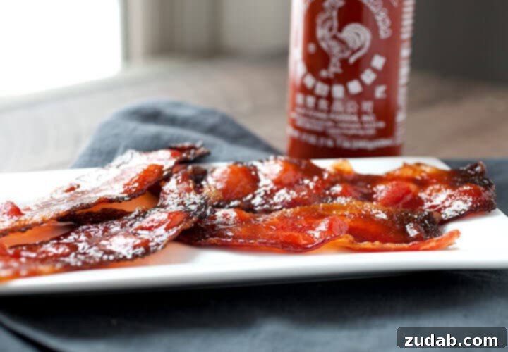 Strips of glistening Sriracha Candied Bacon, caramelized to perfection with a sweet and spicy glaze.
