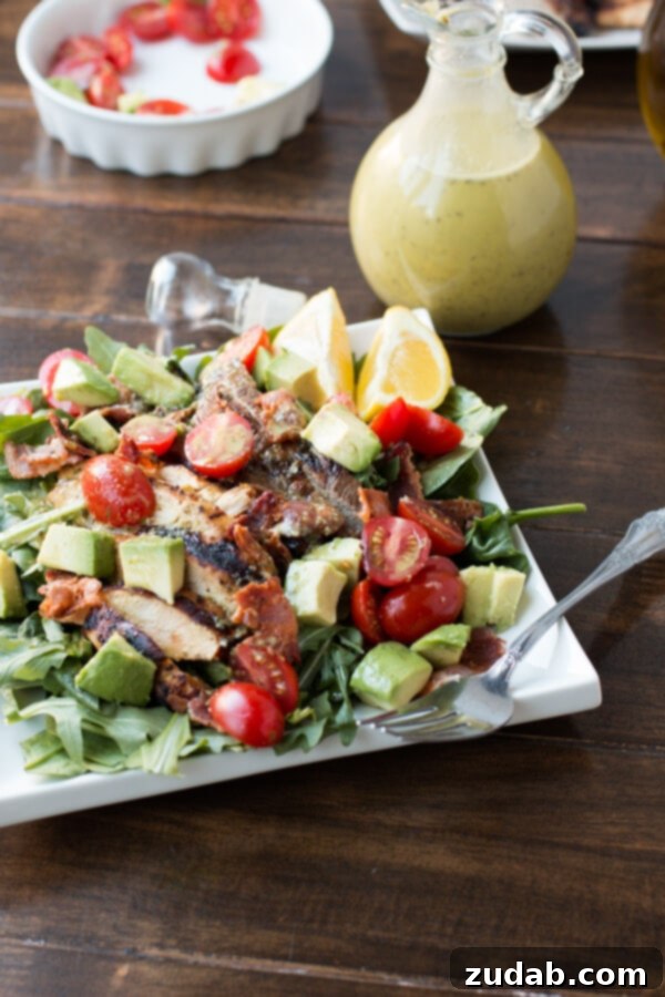 A vibrant Double the Meat Hold the Bread BLT Salad, packed with generous portions of steak, chicken, and bacon with minimal lettuce.