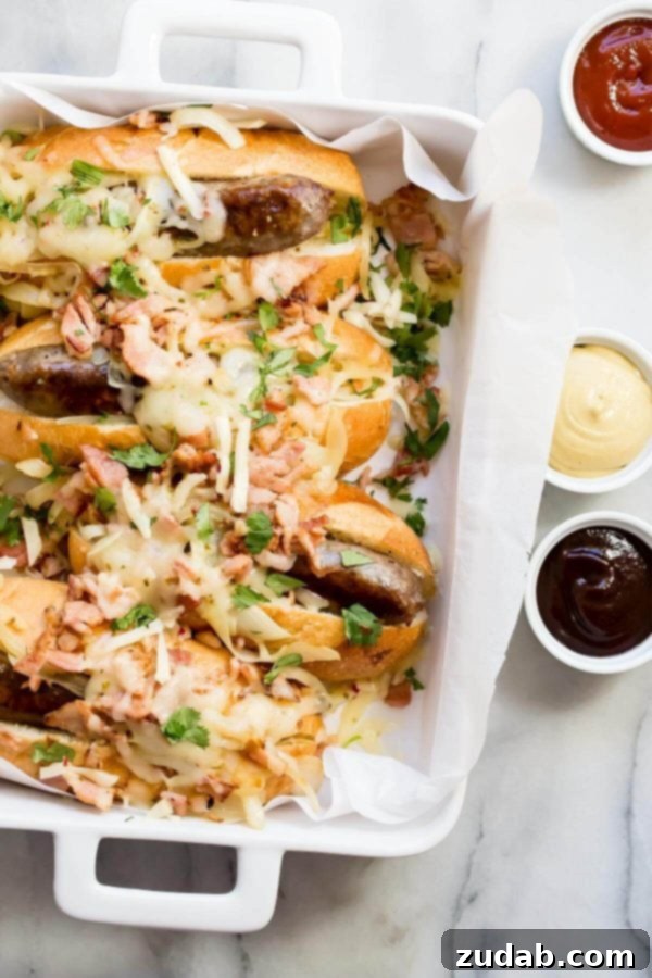 Hearty Bratwurst Hoagies topped with deliciously caramelized onions and bacon, served on toasted buns.