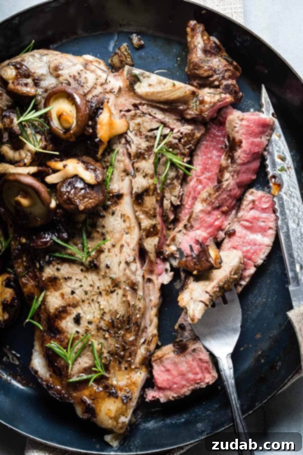 A perfectly grilled juicy Porterhouse Steak topped with sautéed mushrooms, served on a cutting board, ready to be carved.