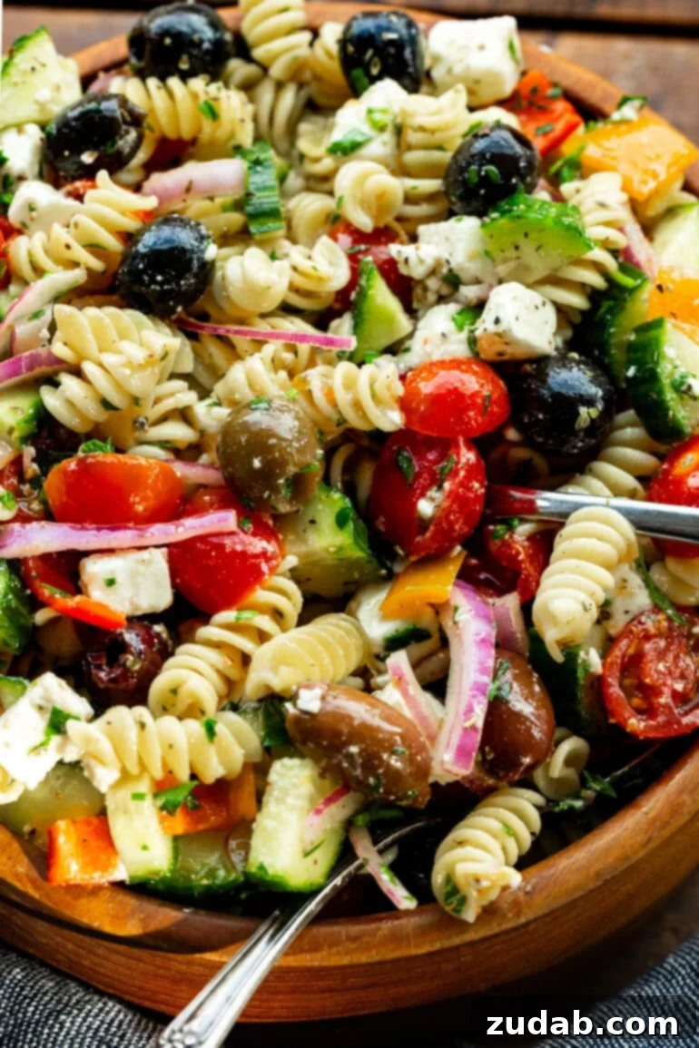 Greek Isles Pasta Salad 2 a photo of Greek pasta salad in a large wooden serving bowl