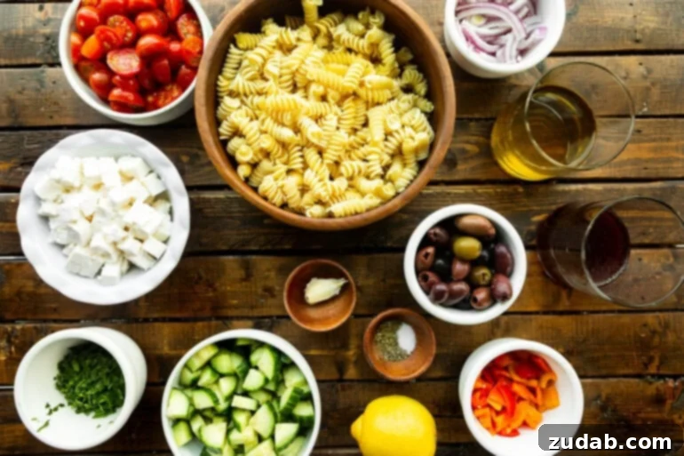 Greek Isles Pasta Salad 3 a photo of all the ingredients for greek pasta salad in separate small bowls