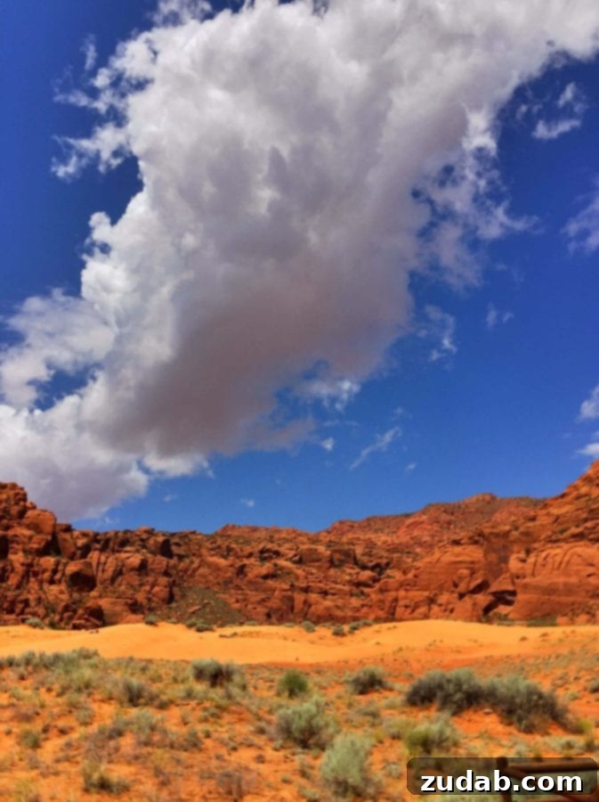 Experience the unforgettable sunsets of Southern Utah A stunning St. George, Utah sunset painting the sky with vibrant colors over the red rock mountains