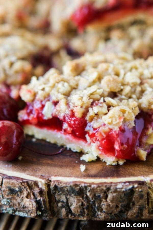 Cherry Crisp Bars: A Mashup Recipe for Summer Desserts Cherry Crisp Bars, a perfect backyard BBQ dessert combining pie and crisp textures.