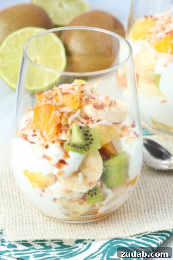 A refreshing Tropical Fruit Yogurt Parfait, bursting with exotic flavors and colors, perfect for breakfast or a healthy snack.