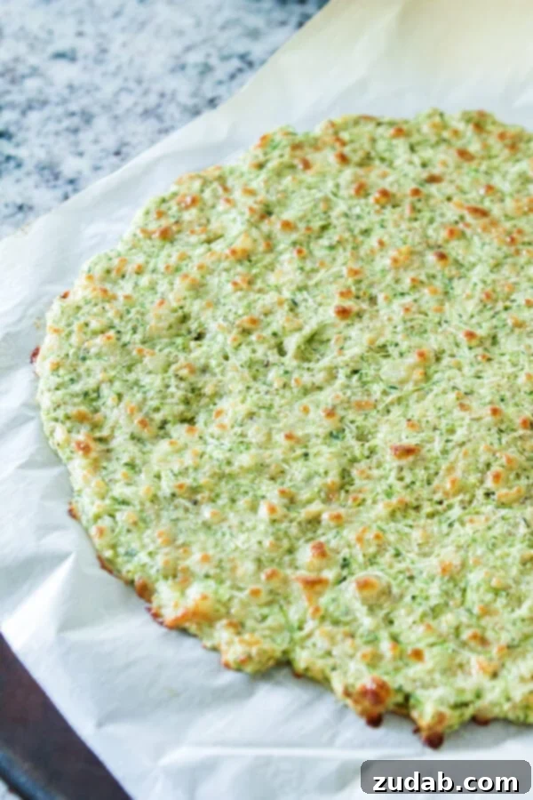 The Joy of a Family-Approved Zucchini Pizza Close-up of a slice of zucchini pizza, showing the crispy crust and melted cheese, irresistible to all family members.