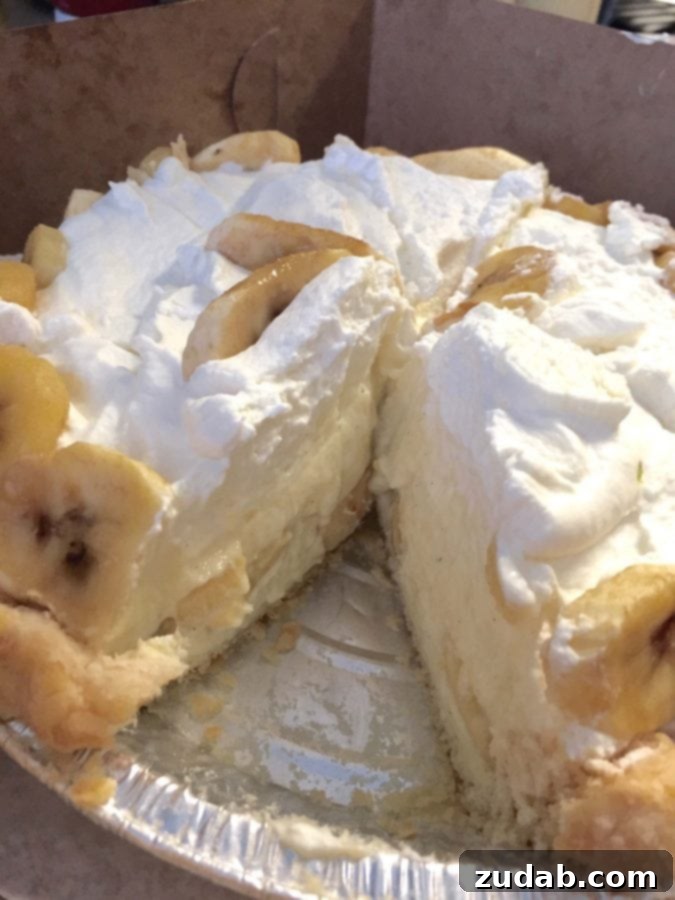 Tilt Portland Banana Cream Pie A slice of creamy banana cream pie with a towering meringue topping from Tilt, Portland.