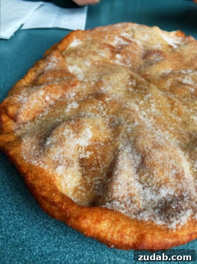 Seaside Elephant Ear Sweet Treat A large, golden elephant ear pastry dusted with cinnamon sugar, a popular treat in Seaside, Oregon.
