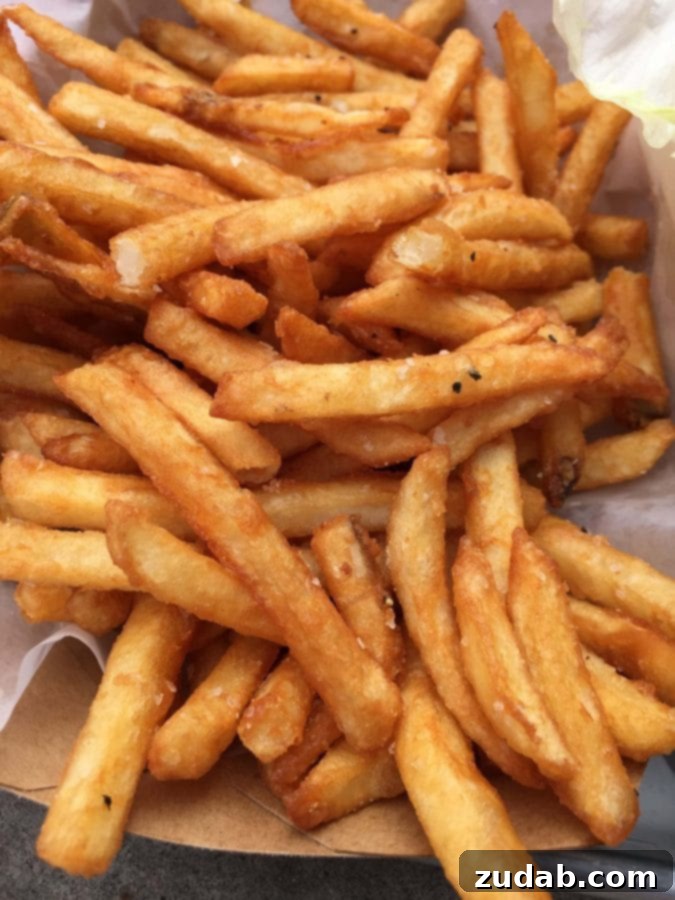 Tilt Portland Signature Fries Crispy golden French fries served hot, a specialty at Tilt in Portland, Oregon.