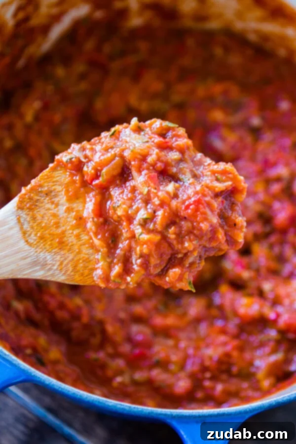 Healthy Garden Veggie Marinara Sauce: A great way to get children to enjoy more veggies with pizza and spaghetti! A graphic emphasizing that marinara sauce is a great way to help children enjoy more vegetables, featuring pizza and spaghetti.