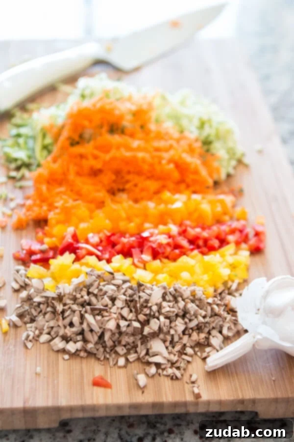 Homemade Garden Veggie Marinara Sauce: A healthy, delicious way to boost veggie intake for kids! ohsweetbasil.com A social media-friendly graphic promoting garden veggie marinara sauce as a healthy way to include more vegetables in kids' meals.