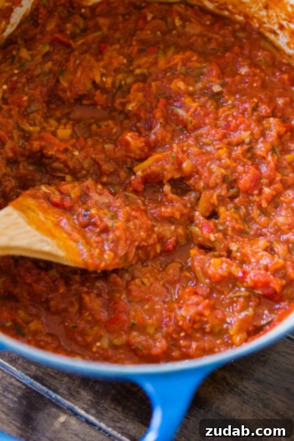 Boost veggies for kids with our homemade garden veggie marinara sauce – great for pizza and spaghetti! ohsweetbasil.com A colorful graphic highlighting the benefits of garden veggie marinara sauce for children, perfect for pizza and spaghetti.