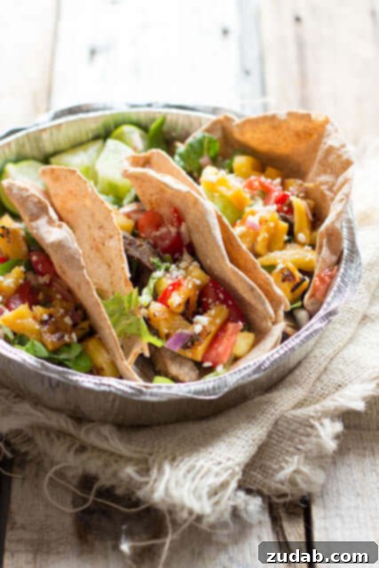 Tangy Tropical Pork Braise 5 Who needs Mexico-! These Steak Tacos with Grilled Pineapple Salsa are so dang good you'll think you're in Cabo San Lucas ohsweetbasil.com