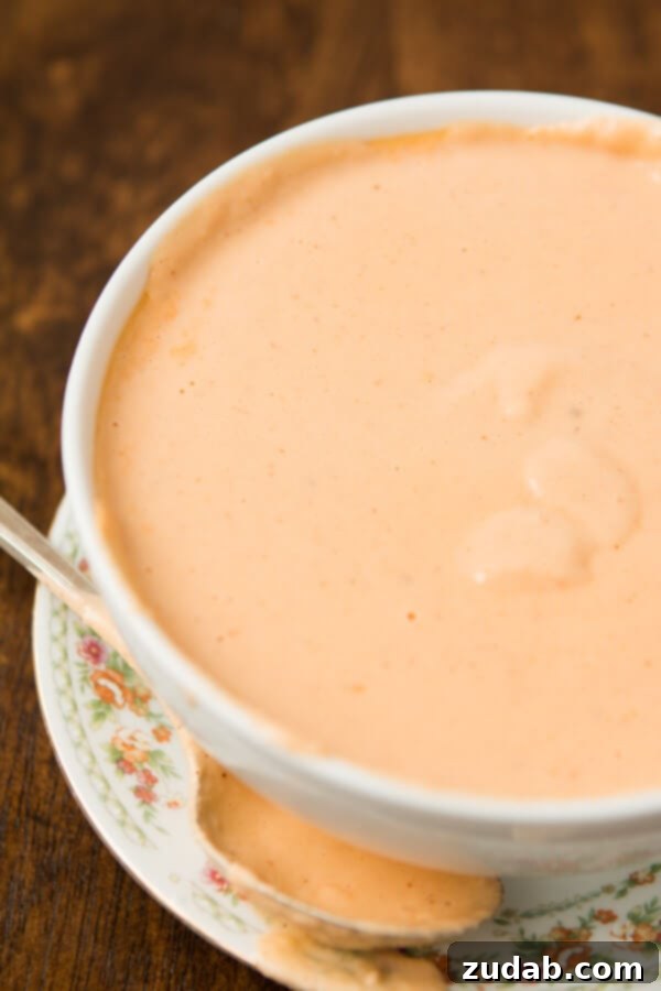 A bowl of hearty Roasted Cauliflower Tomato Soup, rich in color and texture, ideal for a warm meal.