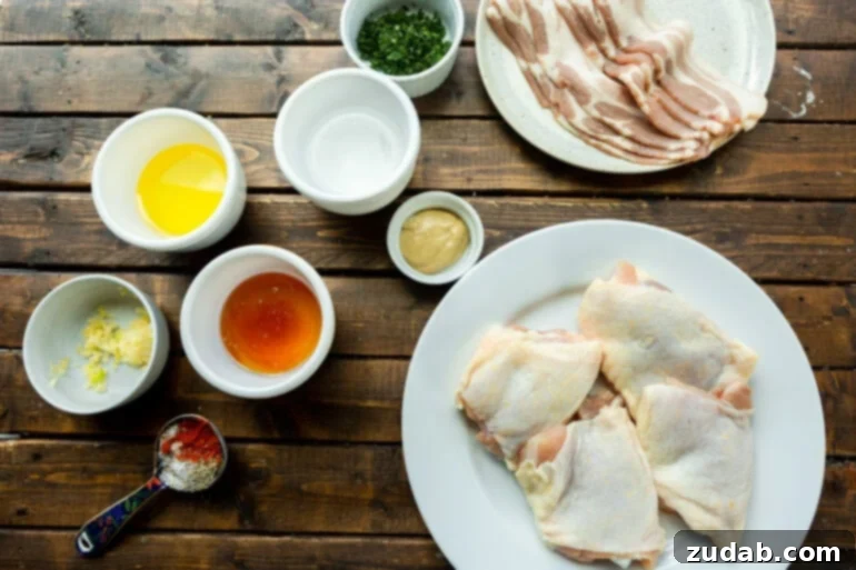 A photo of all the raw ingredients for Honey Mustard Bacon Chicken, neatly arranged in separate small bowls, showcasing their freshness and vibrant colors.