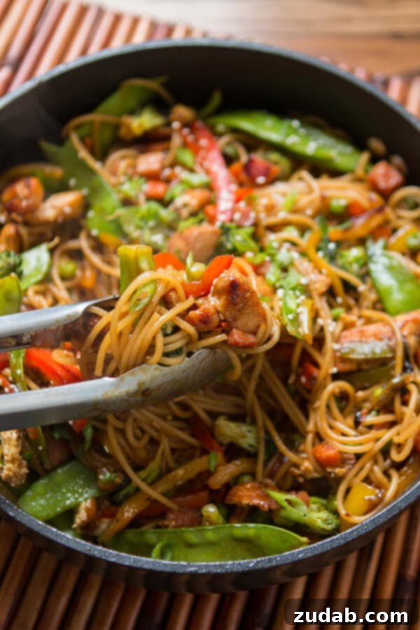 Teriyaki Chicken Noodles: Quick and Flavorful Meal Idea A vibrant bowl of Teriyaki Chicken Noodles, showcasing the blend of tender chicken, crisp vegetables, and perfectly coated noodles.
