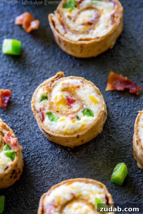 Easy Cheesy Sloppy Joe Sliders 5 Jalapeno Popper Pinwheels, golden and delicious.
