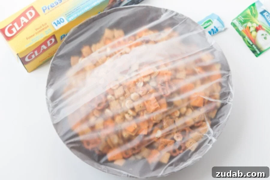 Every party needs something sweet, something salty, something light, and something indulgent. This ranch slow cooker Chex mix perfectly embodies both salty and addicting qualities, making it a truly essential party snack! A perfectly crunchy, savory mix of classic Chex cereal, mini pretzels, buttery oyster crackers, cheesy Cheez-Its, and roasted peanuts, all generously tossed in a zesty ranch seasoning for an explosion of flavor in every bite.